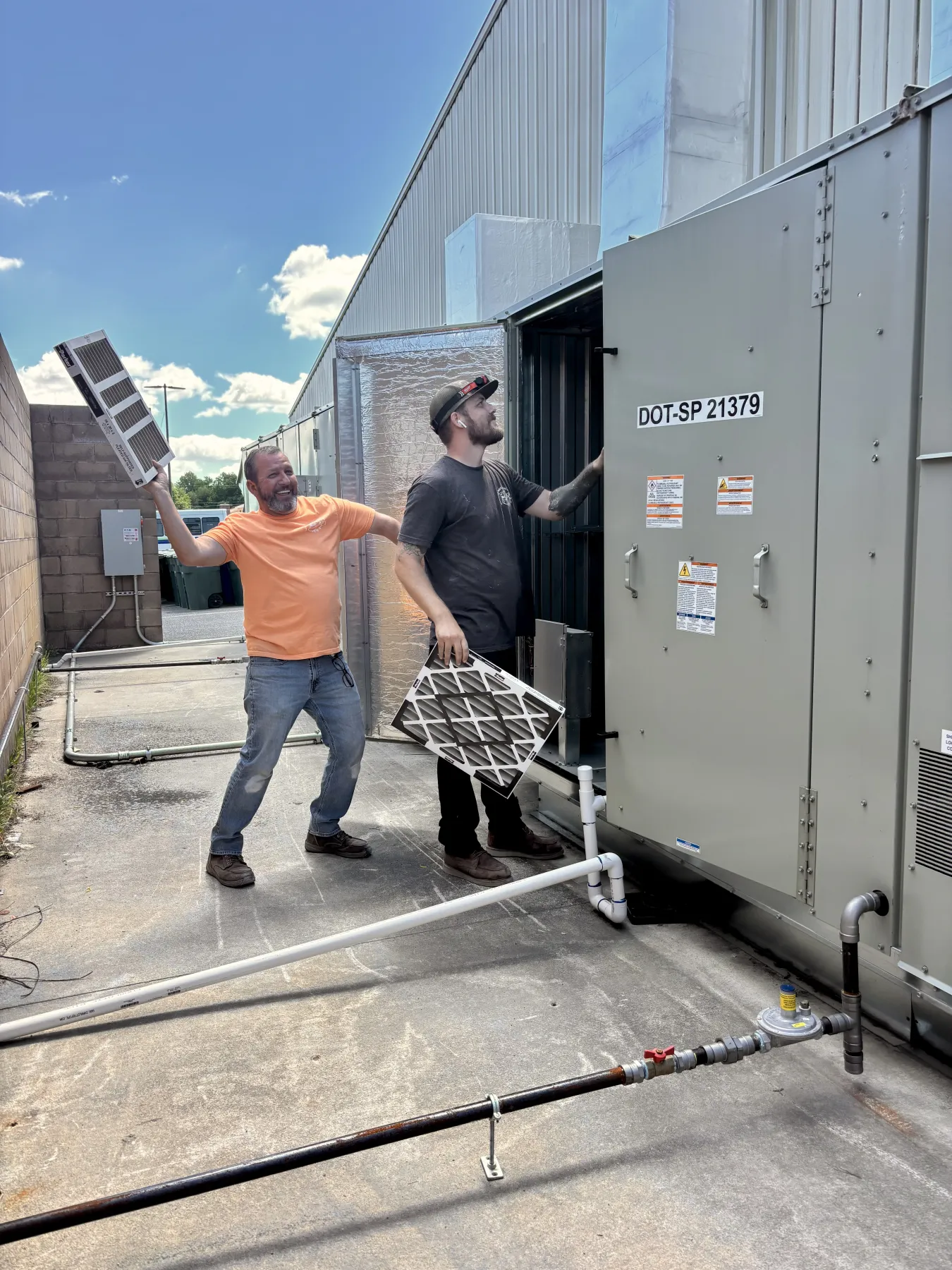Collins Mechanical technicians servicing the rooftop HVAC unit at DE State Memorial Hall Collins Mechanical technicians servicing the rooftop HVAC unit at DE State Memorial Hall
